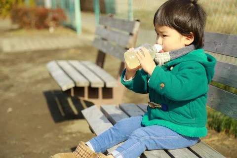 Boy drinking juice Stock Photos