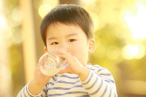Boy drinking juice Foto stock