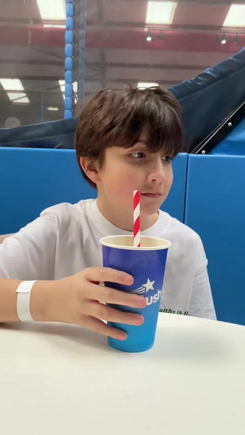 A boy drinking a slushy Stock Footage 262252663
