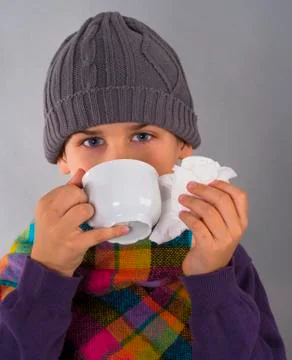 Boy drinking tea Stock Photos