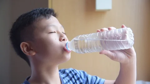 Boy drinking water from bottle,slow motion. Stock Footage 108645784