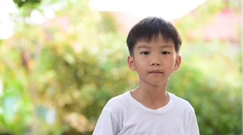 Boy Drinking water in garden Stock Footage 68809634