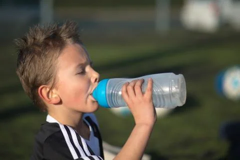 Boy drinking water Stock Photos