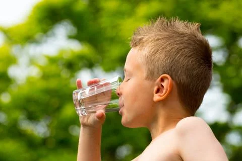 Boy drinking water Stock Photos