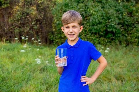 Boy drinking water Stock Photos