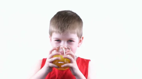 Boy drinking yellow  juice Stock Footage 37204148