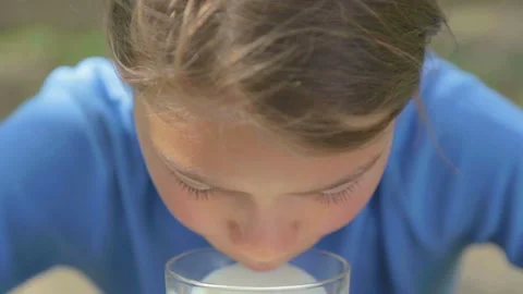 Boy drinks fresh cow's milk, video clips set. Stock Footage 149989750