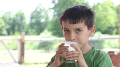 Boy drinks milk Stock Footage