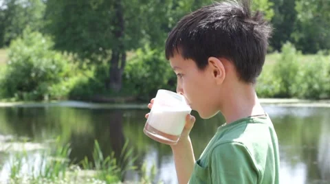 Boy drinks milk Stock Footage