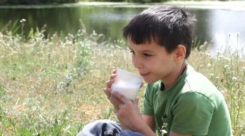 Boy drinks milk Stock Footage