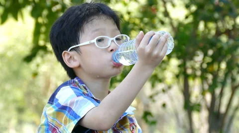 Boy drinks water from a bottle Stock Footage 59572302