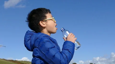 Boy drinks water from a bottle,slow motion Stock Footage 69938270