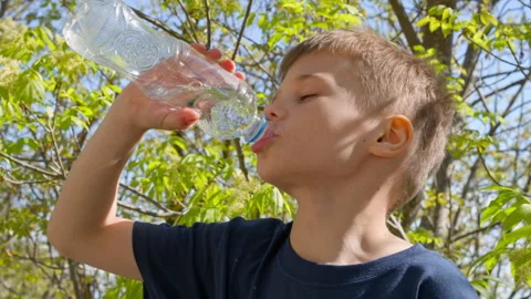 Boy drinks water Stock Footage 308031927