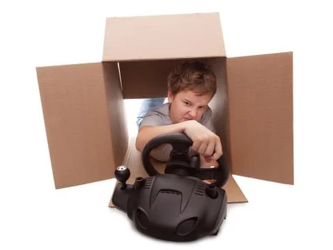 Boy-driver of a cardboard box Foto stock