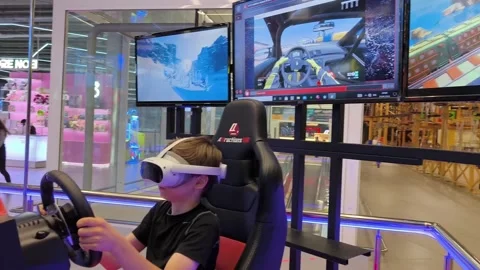 A boy driving a racing game. A boy on a ... | Stock Video | Pond5