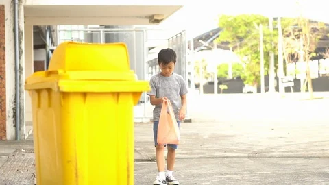 Boy drop a plastic bottle Stock Footage 106524500