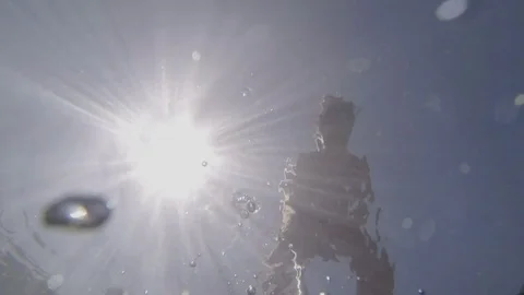 Boy drops the stick-under the water. Stock Footage 76321376