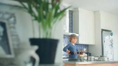 Boy Drumming in the kitchen Stock Footage 279246100