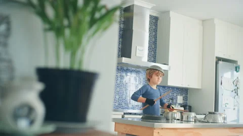 Boy Drumming in the kitchen Stock Footage 279261563