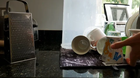 Boy drying up dishes and mugs Stock Footage 111353258