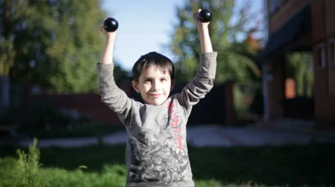 Boy with dumbbells Stock-Footage 881250