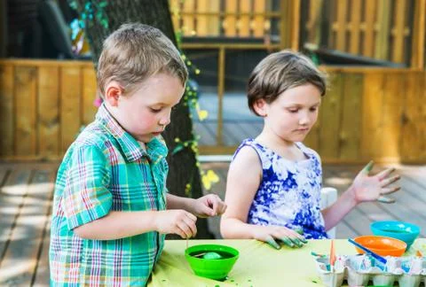 Boy Dyes his Easter Egg Green Stock Photos