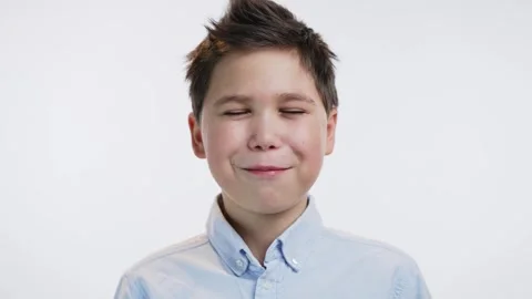Boy eaats chocolate on white background Video stock 241227282
