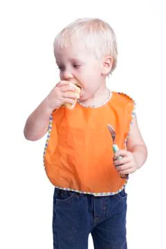 Boy eating apple Stock Photos