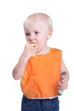 Boy eating apple Stock Photos