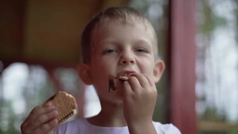 Boy eating a cake Stock Footage 136917966