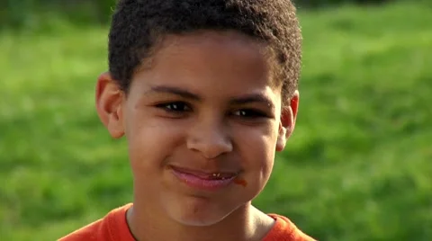 Boy eating a cheeseburger Video stock 8571806