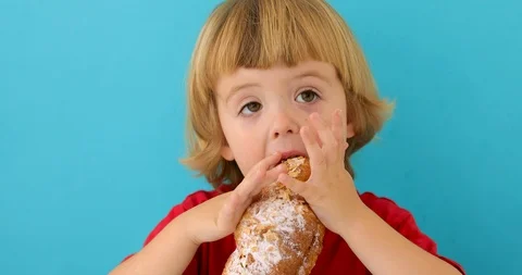 Boy eating croissant Stock-Footage 114440361