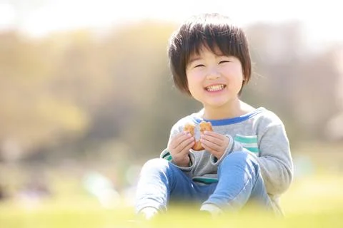 Boy eating donuts Stock Photos
