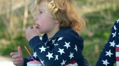 The boy is eating ice cream 動画素材 76006459