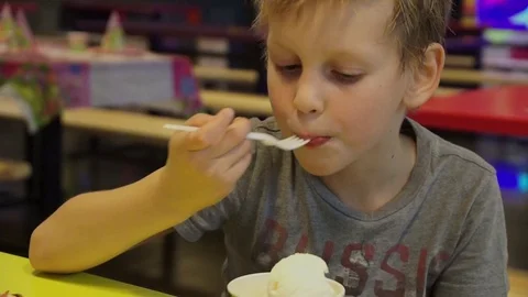 The boy is eating ice cream Stock Footage 88146891