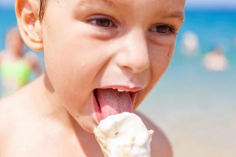 Boy eating ice cream Stock Photos