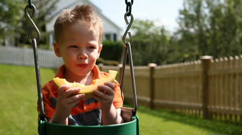 Boy eating melon Video stock 478145