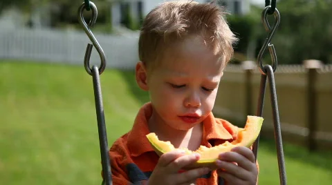 Boy eating melon Video stock 478161