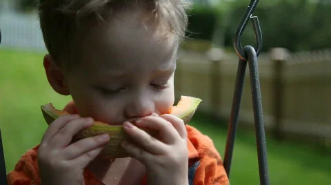 Boy eating melon Video stock 478181