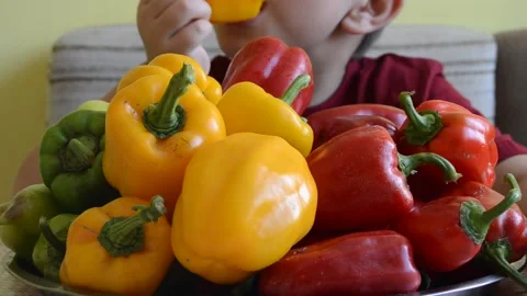 Boy eating pepper Stock Footage 141375114