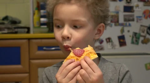 Boy eating pizza. Stock Footage 68363008