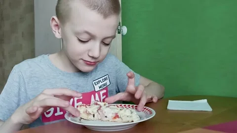 Boy eating pizza Stock Footage 209184829