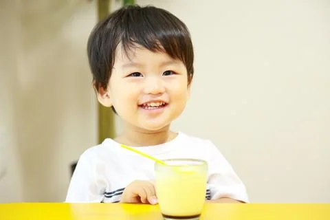 Boy eating pudding Stock Photos