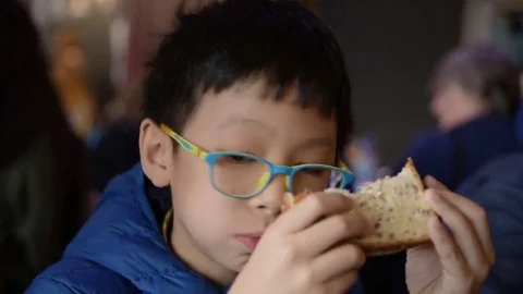Boy eating sandwich Stock Footage 69190877