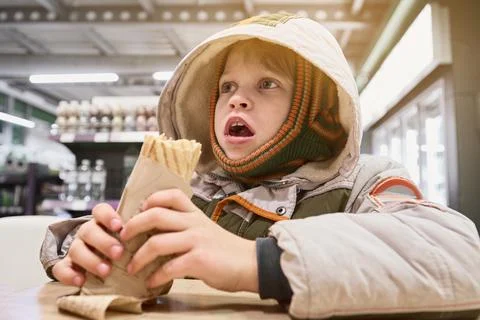 Boy eating snack Stock Photos