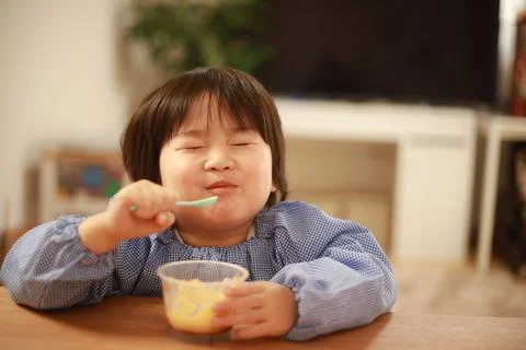 Boy eating snack Stock Photos