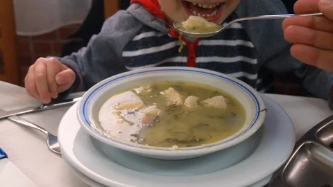 Boy eating soup in restaurant Stock-Footage 103150952