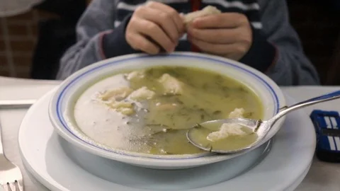 Boy eating soup in restaurant Video stock 103151027