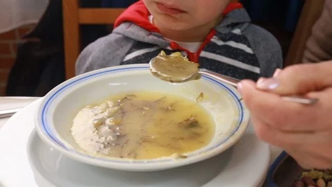 Boy eating soup in restaurant Stock-Footage 103152722