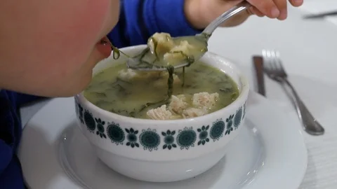 Boy eating soup in restaurant Stock-Footage 105869079